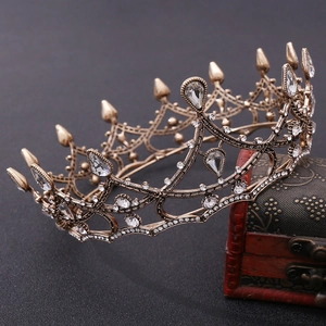 Detailed macro view of bronze baroque crown with rhinestones and teardrop gems
