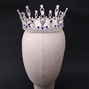 Detailed macro view of the silver bridal crown featuring blue gemstones and white rhinestones