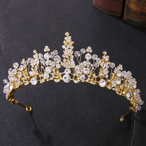 Close-up of golden bridal crown featuring intricate beadwork and sparkling crystals