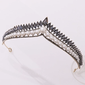 Detail view of gold bridal crown with white pearls and grey marquise rhinestones