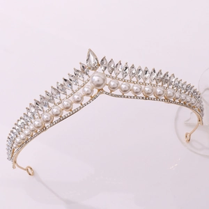 Detail of gold pearl bridal tiara with V-shaped crystal clusters and drop stones