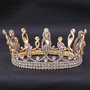 Detailed view of the sparkling water-drop crystals on the gold bridal crown accessory