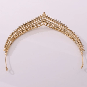Detailed back view of a minimalist golden bridal crown with intricate drop-shaped design