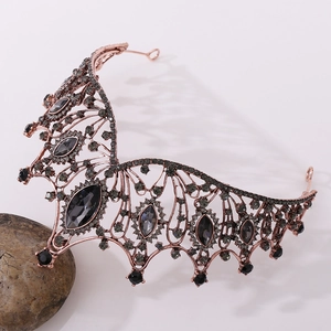 Detailed macro view of black baroque tiara with vintage bronze alloy and dark crystals
