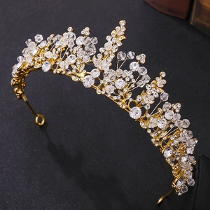 Detail of elegant gold bridal crown with shimmering clear crystals and rhinestones