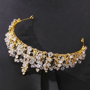 Exquisite gold bridal crown with sparkling crystals and rhinestones for wedding hairstyling
