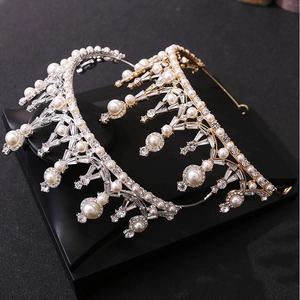 Elegant Baroque crown set with white crystals and pearls in gold and silver finishes