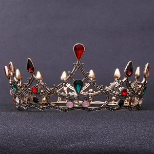 Detail of luxury baroque crown showing bronze alloy filigree and multicolored rhinestones