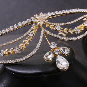 Elegant gold bridal headband with sparkling rhinestones and teardrop crystal pendants
