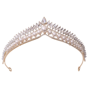 Elegant gold bridal crown with white pearls and sparkling crystal rhinestones on white background