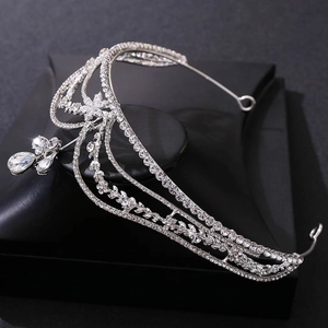 Elegant floral bridal crown with sparkling rhinestones on a black jewelry stand