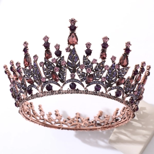 Close-up of vintage Baroque bridal crown with purple crystals and metal leaf details