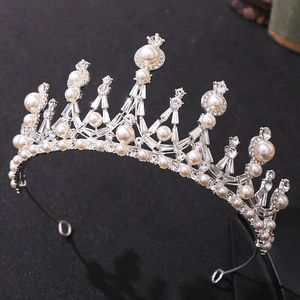 Elegant silver bridal crown with white pearls and sparkling crystal rhinestones