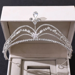 Close-up of silver bridal crown with rhinestones and star flower design in gift box