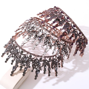 Detail of Baroque bridal crown featuring red crystals and vintage leaf filigree