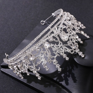 Baroque silver bridal tiara with sparkling rhinestones and pear-shaped crystals on black base