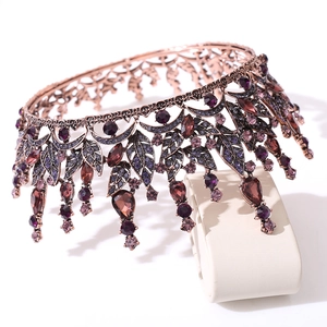 Detailed view of Baroque bridal crown with vintage purple crystals and leaf patterns