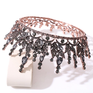 Detailed macro view of the bronze leaf base and dark crystal inlay on baroque crown
