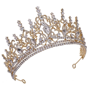 Detailed macro view of baroque golden crown with intricate rhinestones and water drop crystals