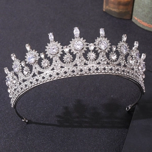 Detailed view of bridal silver crown with sparkling crystal starburst elements