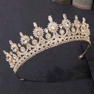 Elegant gold bridal crown with sparkling zircons and crystals for wedding hairstyles