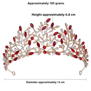 Close-up of golden bridal tiara with red crystals, 6.8cm height and 15cm diameter size