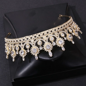 Detailed macro view of golden bridal crown with sparkling zircon crystals on black stand