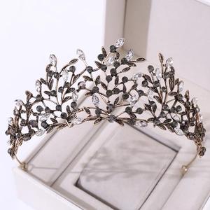 Detail of a vintage Baroque bridal crown with black rhinestones and bronze leaf design