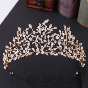 Detail of golden leaf bridal crown with sparkling rhinestones and vintage floral design