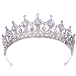 Elegant silver bridal crown with sparkling zircons and marquise stones on white background