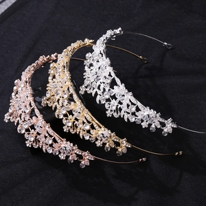 Close-up of bridal crowns in rose gold, gold, and silver with rhinestones and crystals