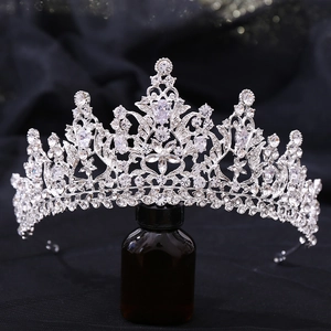 Macro detail of a silver bridal crown featuring 3A zircon and floral crystal patterns