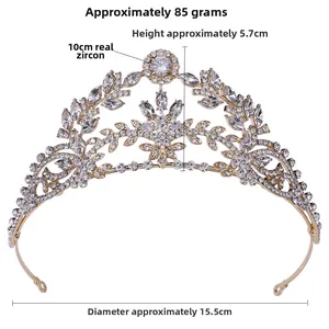 Detailed macro of golden bridal tiara with leaf-shaped zirconia and intricate crystal patterns