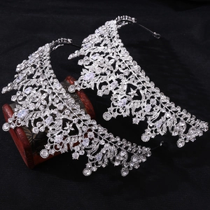 Macro detail of bridal crown featuring dense 3A zircon stones and intricate silver floral patterns