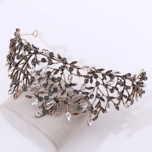 Detailed side view of vintage Baroque bronze leaf tiara with smoke grey rhinestones