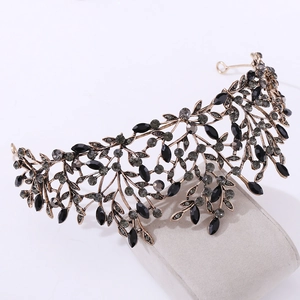 Detail view of Baroque leaf crown with black rhinestones and vintage gold metal finish