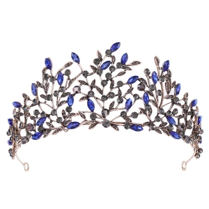 Detail of vintage bronze leaf tiara featuring navy blue navette gems and small grey crystals