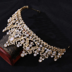 Detailed macro view of bridal crown with 3A zircon and intricate gold floral filigree