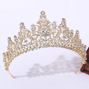 Close-up of elegant gold bridal crown featuring intricate vine patterns and sparkling 3A zircons