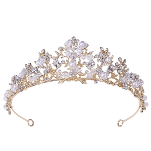 Elegant gold bridal tiara with white pearls and sparkling crystals on white background