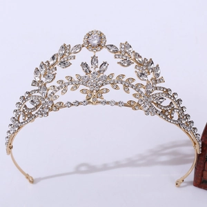 Detailed macro view of bridal crown with gold leaves and inlaid marquise zircons