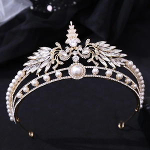 Close-up of golden bridal crown featuring elegant white pearls and sparkling rhinestones