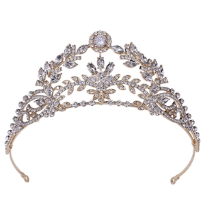 Elegant gold bridal crown with leaf patterns and shimmering cubic zirconia stones