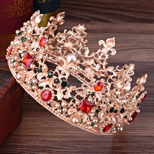 Baroque bridal tiara with red crystals and pearls on vintage background