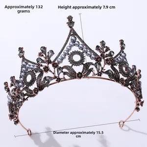 Detail view of Baroque vintage black tiara with crystals and grey pearls for brides