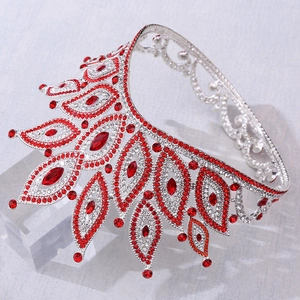Macro detail of Baroque silver tiara with luxury red rhinestones and radiating leaf patterns