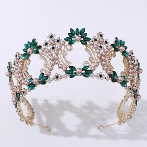 Baroque luxury bridal crown with pink pearls and green crystals on a gold metal frame