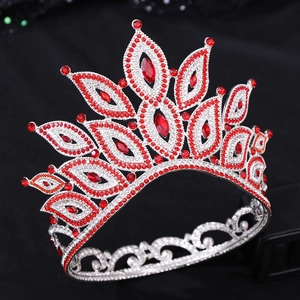 Detailed side view of Baroque red bridal crown with silver plating and luxury rhinestones