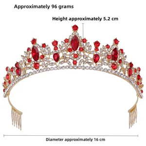 Detailed macro view of bridal tiara featuring red gems and sparkling rhinestones on golden frame