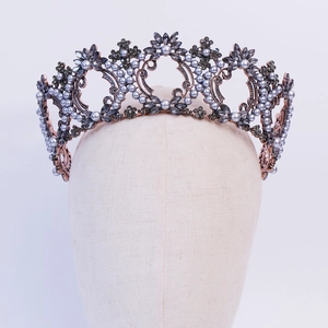 Detailed macro view of Baroque bridal crown with grey pearls and antique bronze floral metal